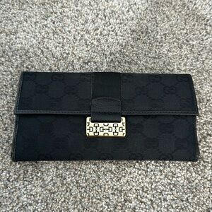 Black Gucci wallet with horse bit metal detail